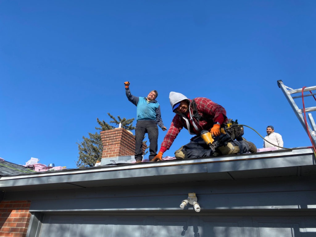 Alex and Beto of E&F Construction having fun on the roof